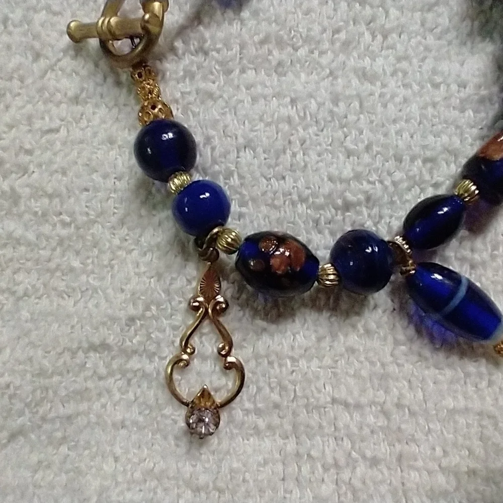 Goldtone blue glass beaded crystal cross toggle wire Bracelet
